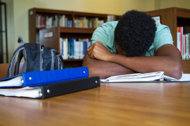 Teen overwhelmed by schoolwork
